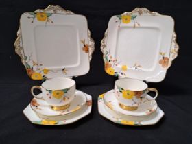 PARAGON TEA SET the white ground decorated with flowers and gilt highlights, comprising five cups,