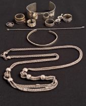 SELECTION OF SILVER JEWELLERY including a cuff bangle, various rings, a long multi strand