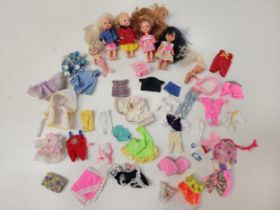 FOUR MATTEL BARBIE SISTER DOLLS with a selection of clothing; a Barbie baby doll, etc.