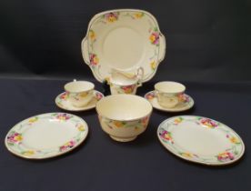 CROWN STAFFORDSHIRE TEA SET decorated with a yellow ground with a floral border and gilt highlights,