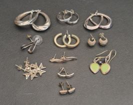ELEVEN PAIRS OF SILVER EARRINGS including five pairs of hoop earrings, a pair of enamel drop