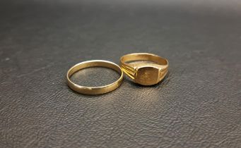 TWO GOLD RINGS one a fourteen carat gold band, ring size X and 1.9 grams; and the other a nine carat