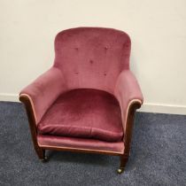 VICTORIAN MAHOGANY ARMCHAIR with a button back and loose seat cushion, standing on tapering front