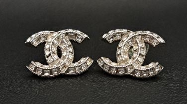 PAIR OF CHANEL CC PASTE SET EARRINGS in silver tone, both with marks to reserve