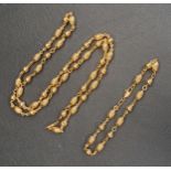 NINE CARAT GOLD NECKLACE AND MATCHING BRACELET both with alternating round and ribbed oval beads,