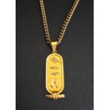 EGYPTIAN EIGHTEEN CARAT GOLD PENDANT decorated with hieroglyphs, 4.2cm high and approximately 3.6