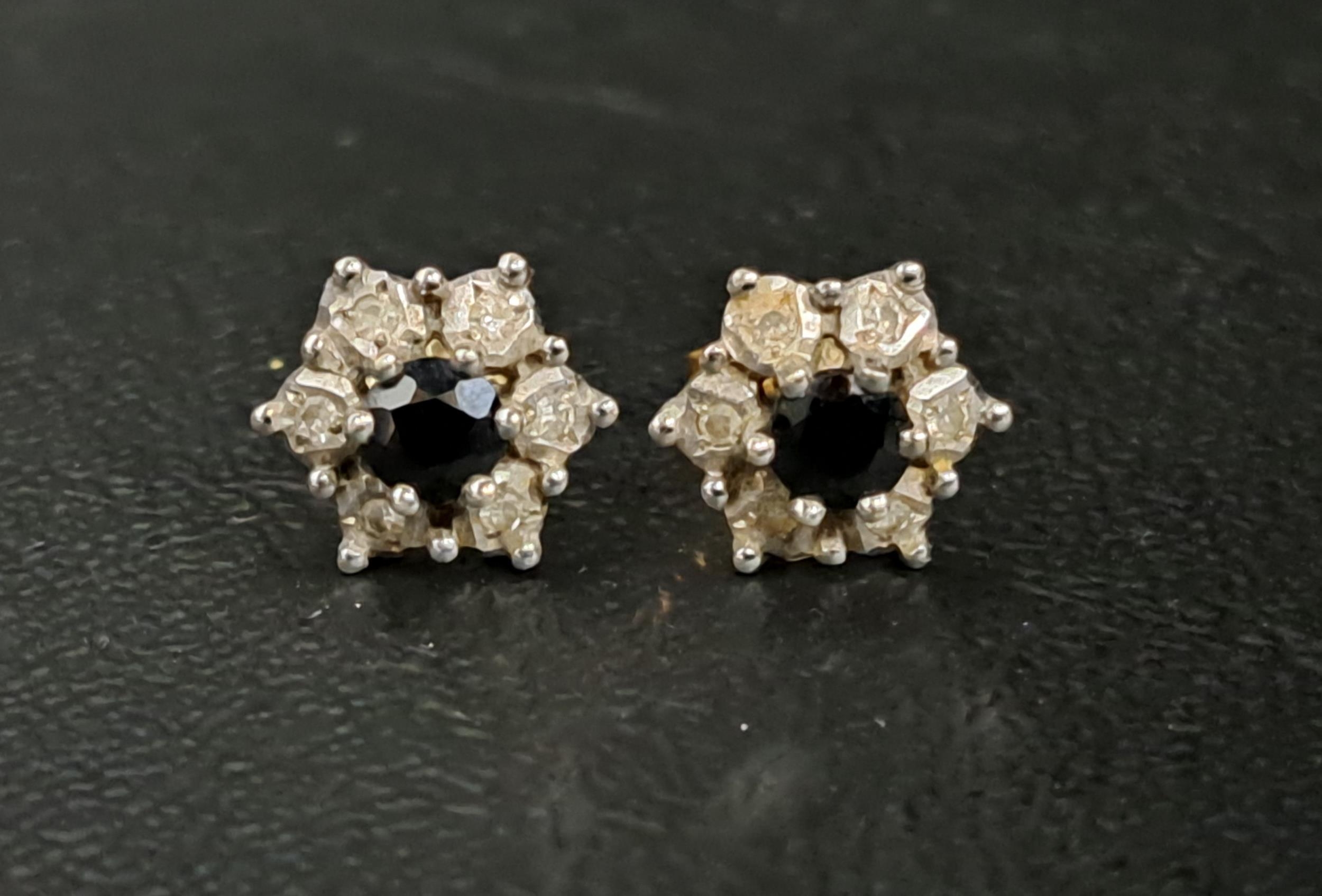 PAIR OF SAPPHIRE AND DIAMOND CLUSTER EARRINGS the central sapphire on each in six diamond - Image 2 of 2