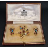 UNUSUAL MULTI GEM SET BROOCH AND MATCHING EARRINGS all of branch design and set with diamonds,