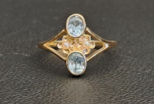 PRETTY BLUE TOPAZ AND SEED PEARL RING each of the oval cut blue topaz gemstones approximately 0.