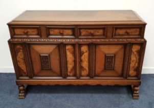 OAK AND WALNUT SIDEBOARD with two panelled frieze drawers above two panelled cupboard doors,