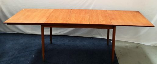 VINTAGE TEAK EXTENDINING TABLE with a pull apart top revealing three fold out leaves, standing on