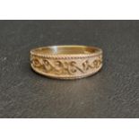 ATTRACTIVE NINE CARAT GOLD BAND with relief scroll decoration, ring size P-Q and approximately 3.4