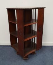 LARGE REVOLVING WALNUT BOOKCASE with a configuration of three tiers, on a carved platform with
