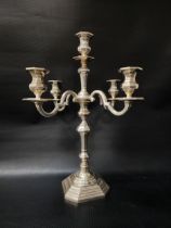 PORTUGUESE SILVER CANDELABRA raised on a stepped octagonal base with a central shaped column and