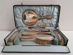 GEORGE V SILVER DRESSING TABLE SET comprising a hand mirror, comb, two large brushes and two other
