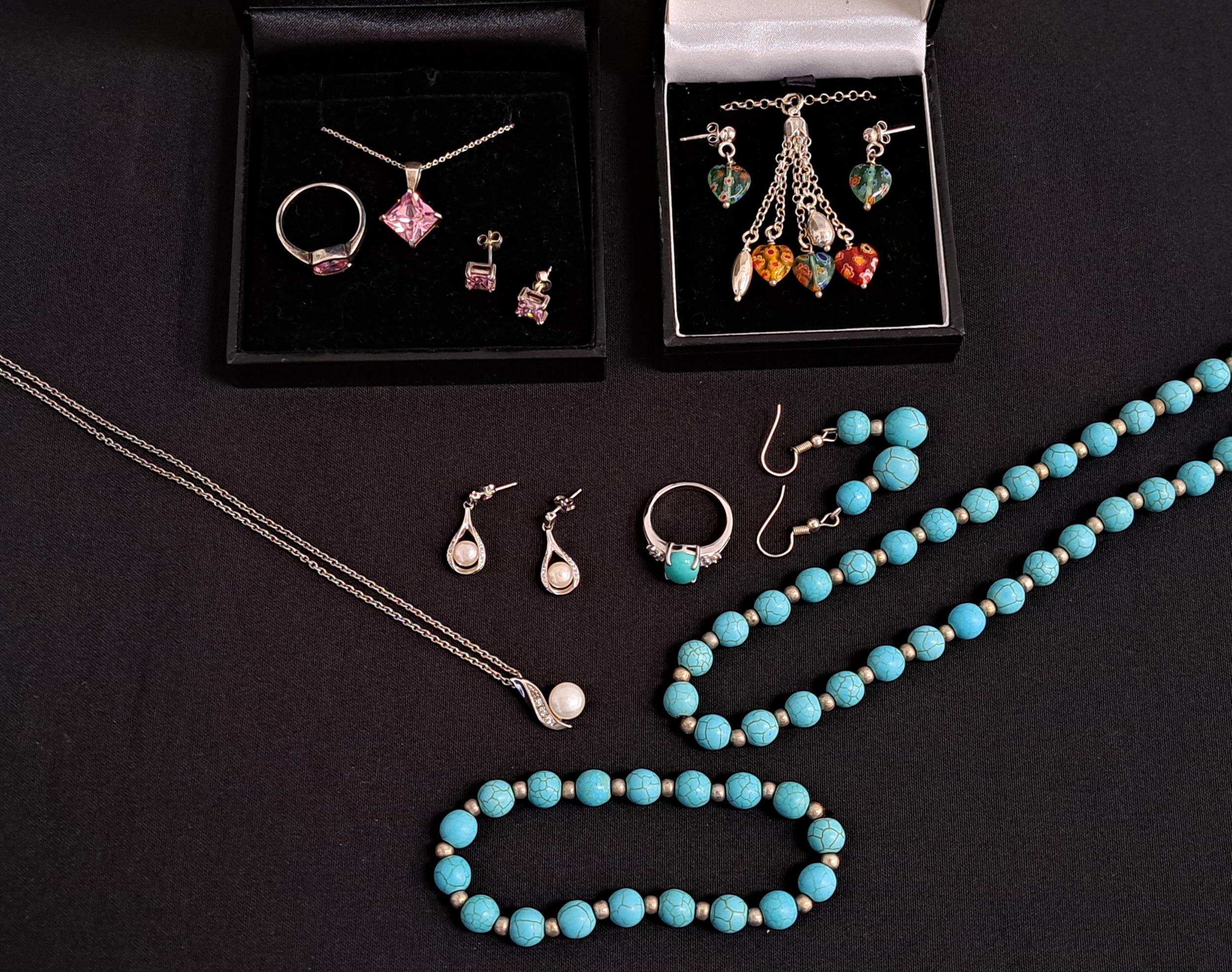 FOUR SUITES OF JEWELLERY comprising a turquoise bead necklace, bracelet, earrings and ring; a pink