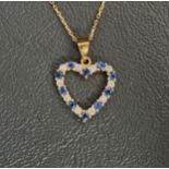 SAPPHIRE AND DIAMOND HEART SHAPED PENDANT in nine carat gold and on nine carat gold chain,