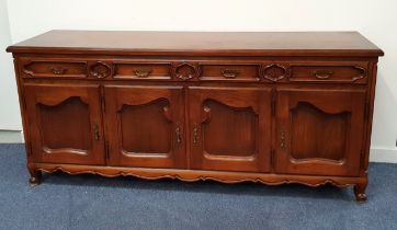 CONTINENTAL ELM SIDEBOARD with a moulded top above four panelled frieze drawers and four panelled