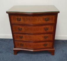 GEORGE III STYLE MAHOGANY SERPENTINE CHEST with four cockbeaded drawers and standing on bracket