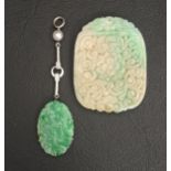 CARVED JADE PENDANT the oval jade panel below gold bars and small seed pearl, in nine carat white