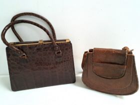 LADIES CAIMAN SKIN HANDBAG with a brass bar snap closure and carry handles, the interior with two