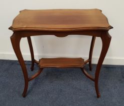 EDWARDIAN MAHOGANY OCCASIONAL TABLE with a shaped rectangular top on shaped supports, united by an