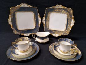 PARAGON TEA SET decorated with a white ground with a blue border with gilt floral highlights,