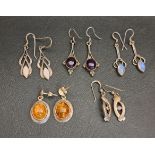 FIVE PAIRS OF GEM SET SILVER DROP EARRINGS set respectively with amber, moonstone, amethyst