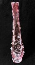 A cranberry glass vase, of inverted baluster form, with relief moulded floral decoration, with