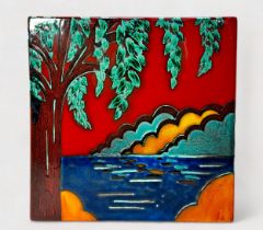 A contemporary studio pottery square panel by Anita Harris, decorated with a tree by water with