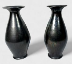 A pair of glazed brown iridescent vases, of tapering ovoid form, with wide flanged neck, metallic