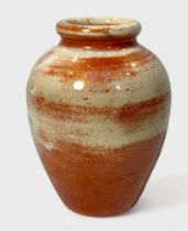 A Moorcroft Pottery ovoid vase with 'weathered' orange lustre glaze, impressed mark to base, 16cm