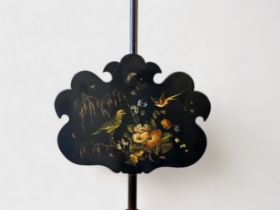 A 19th Century adjustable rosewood pole screen, shaped black papier-maché panel depicting exotic