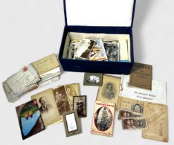 A collection of approximately 150 assorted postcards and photographs, with a quantity of various