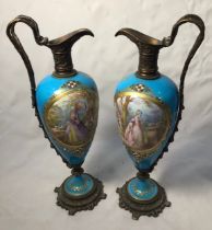 A fine pair of early 19th century bronze-mounted Sevres 'Style' porcelain ewers, the ovoid bodies