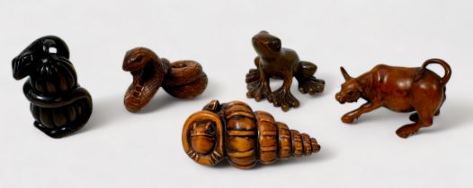Five various Japanese carved and stained boxwood Netsuke, signed, including a Bull, Frog, Cobra,