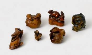 Six various Japanese carved and stained boxwood Netsuke, signed, including two rats on a boot, three