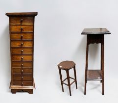 A modern stained walnut tall narrow chest of ten narrow drawers with turned pulls, 36cm wide x 113cm