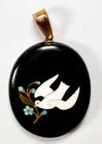A Victorian Pietra dura locket, oval form, black onyx inlaid with white stone dove and floral motif,