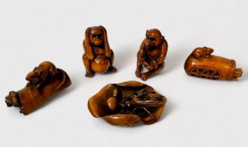Five various Japanese carved and stained boxwood Netsuke, signed, including a cat and rat in basket,