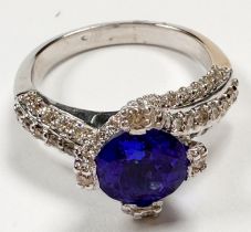 An 18ct white gold dress ring, claw set with a round-shaped tanzanite to the centre, measuring