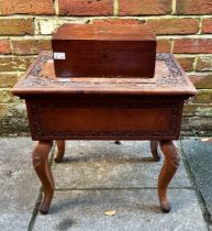 A 20th Century Indian hardwood sewing box, blind fret carved foliate borders, hinged top opens to