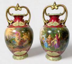 A pair of Vienna style Porcelain vases of ovoid baluster form with scrolled gilt-handles, gilt-