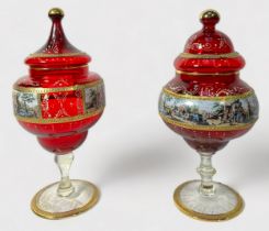 Two Czech Bohemian ruby glass vases and covers, each with central bands of printed and painted