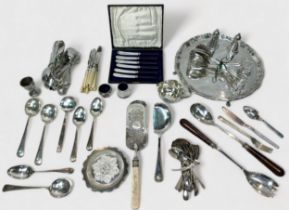 A good collection of assorted silver-plated hollowware and flatware including a cocktail shaker, a