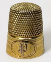 An American 14K Gold Thimble, milled with a band of horizontal reeding, cartouche engraved with