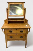 A 19th Century stripped pine dressing chest, with adjustable square mirror over shelf, two long