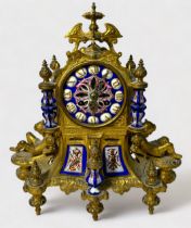 A 19th Century French gilt-metal and enamelled porcelain mounted mantel clock garniture, the