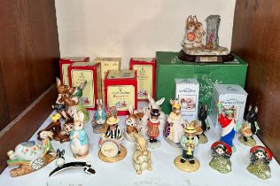 A collection of assorted ceramic bunny figures including Royal Doulton, Royal Albert, Beswick and W.