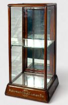 A vintage wooden shop-counter display cabinet, c.1930’s, the mahogany and glazed case with door to